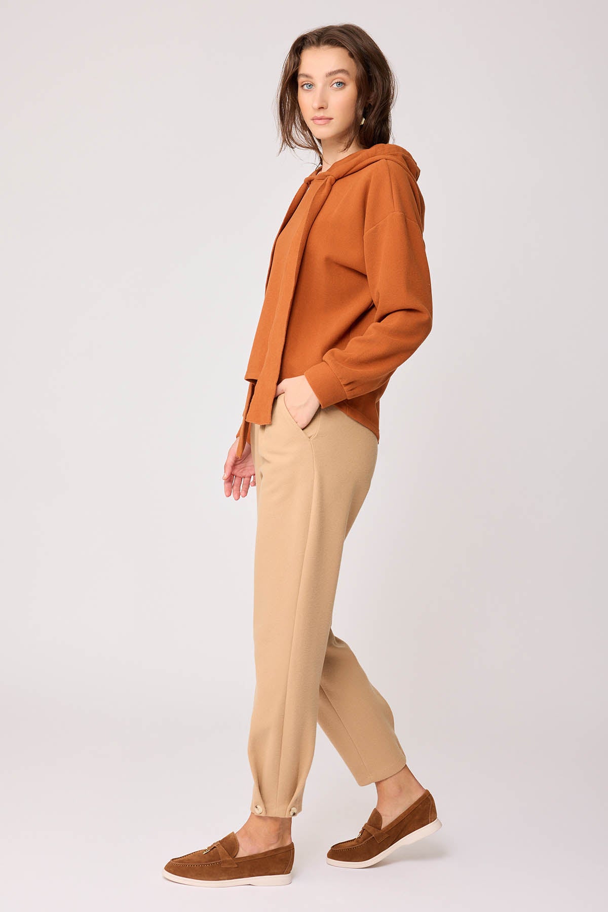 KNITTED TROUSERS WITH CUTOUT BUTTONS