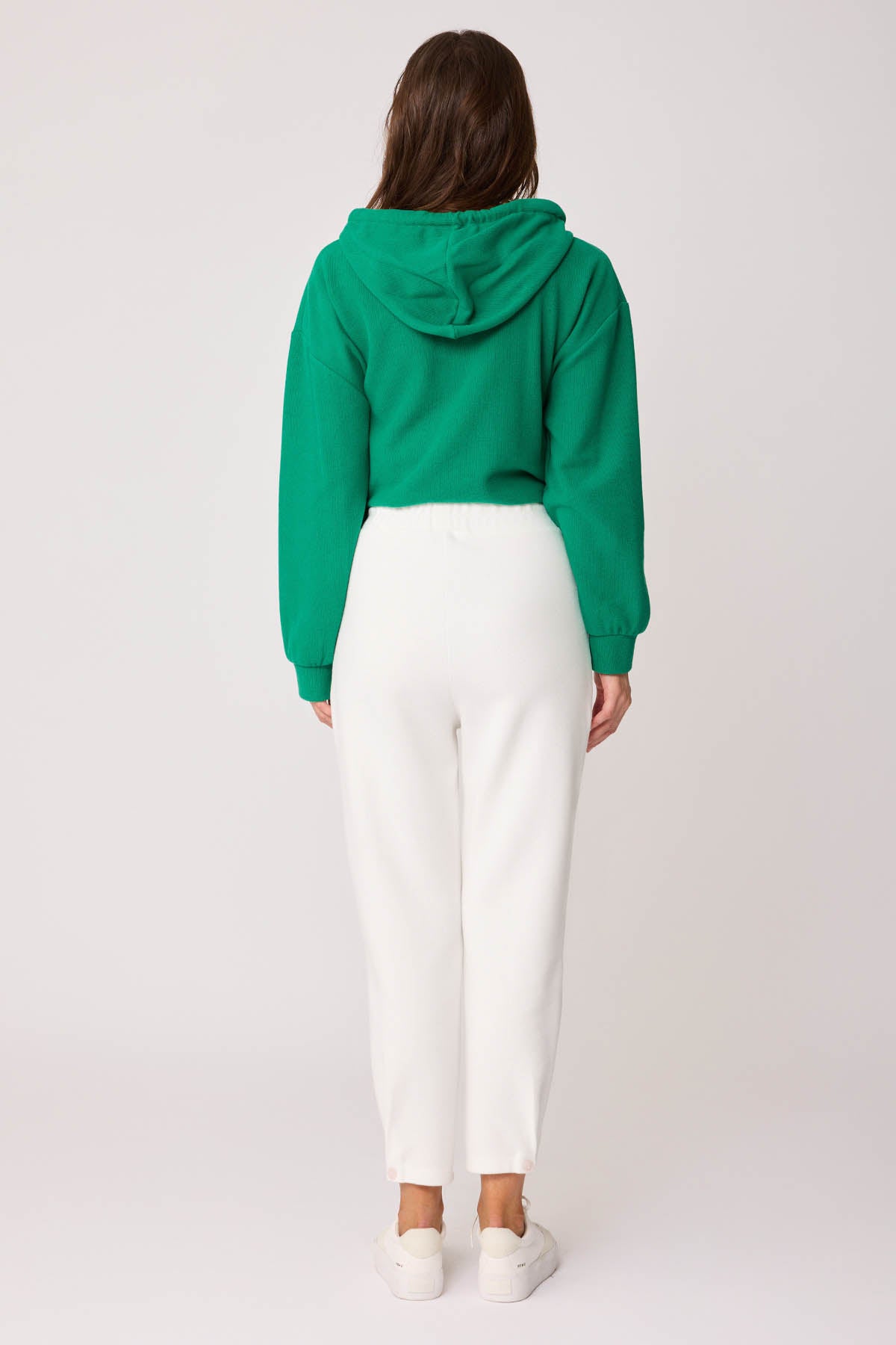 KNITTED TROUSERS WITH CUTOUT BUTTONS