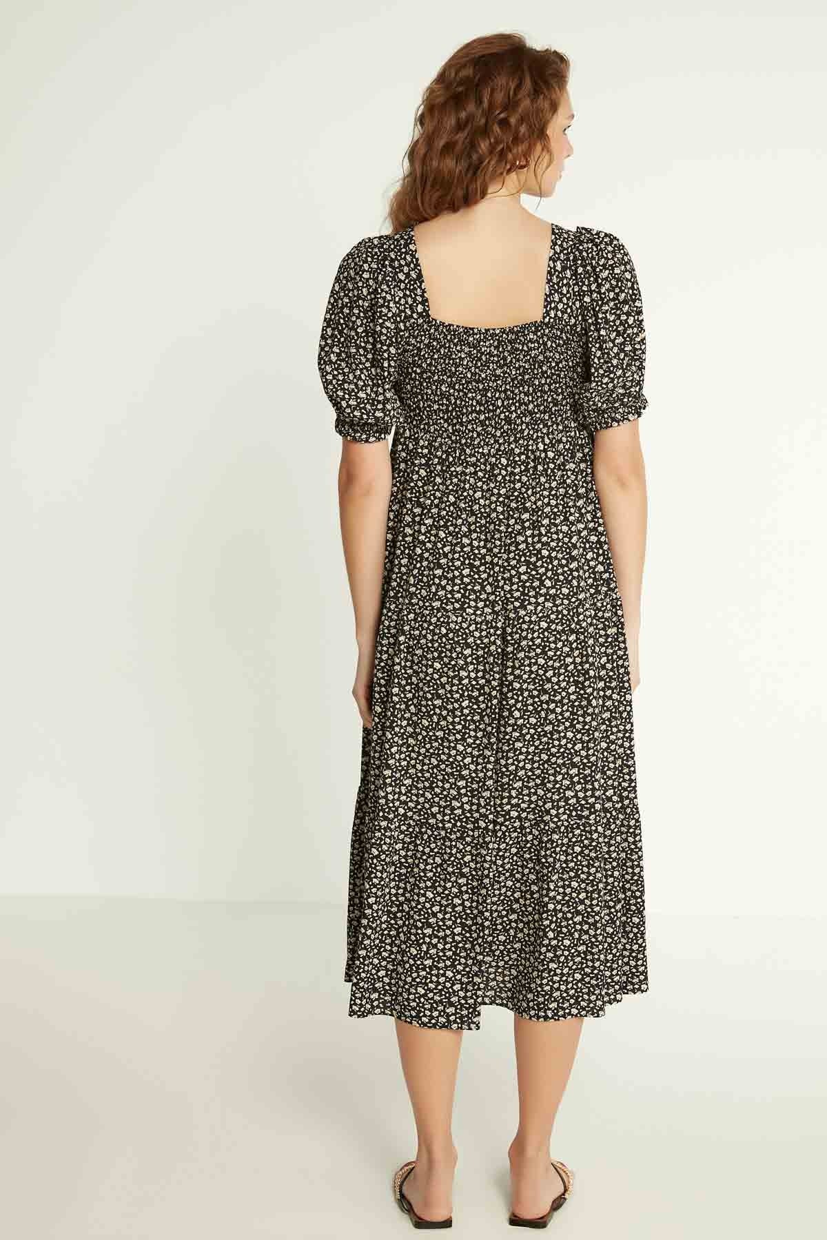 LONG DRESS WITH COILED SLEEVES AND FLORAL PATTERN