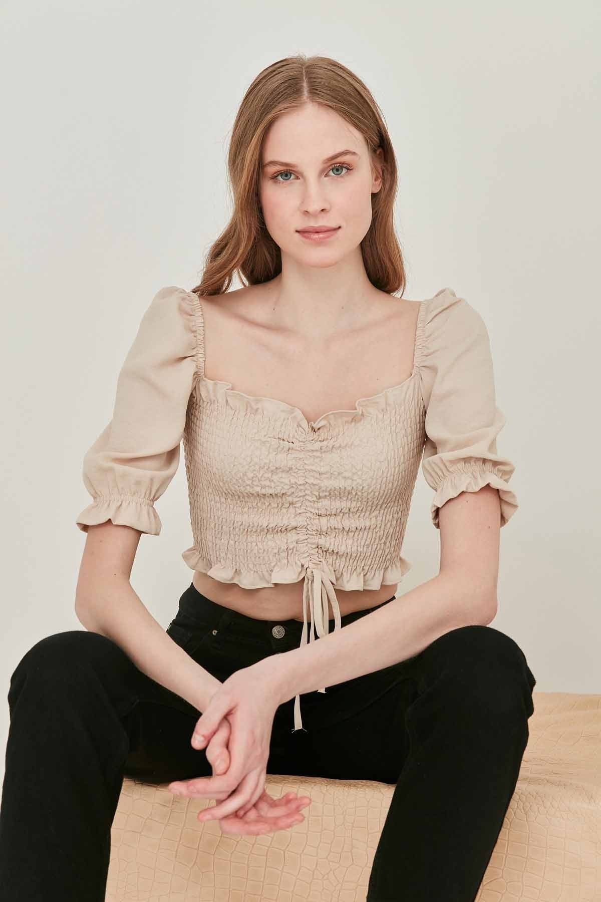 COILED FRONT DRAWSTRING TROJAN SLEEVE BLOUSE