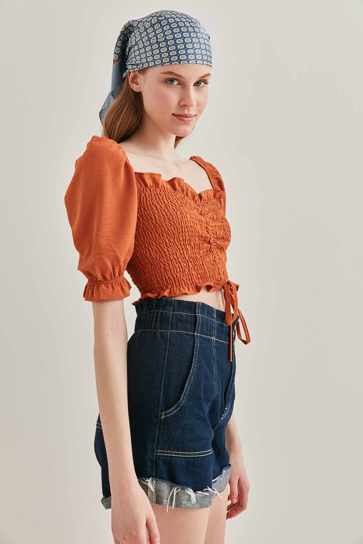 COILED FRONT DRAWSTRING TROJAN SLEEVE BLOUSE