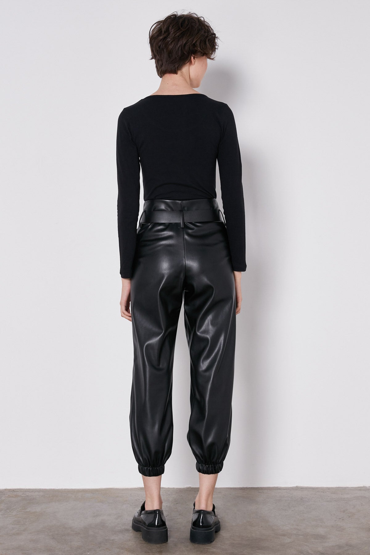ARCHED BELT TRACK ELASTANE WAIST FAUX LEATHER TROUSERS