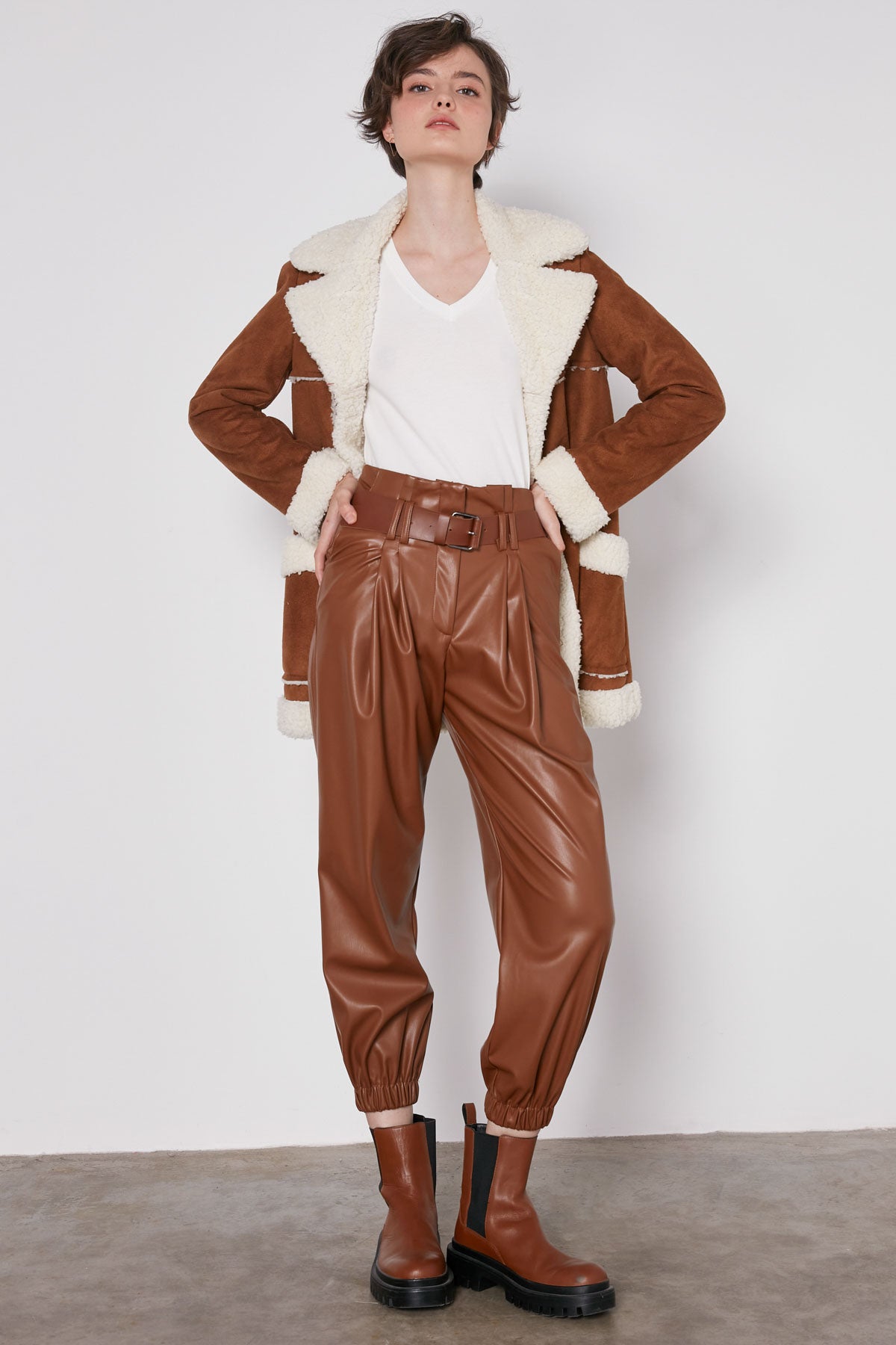 ARCHED BELT TRACK ELASTANE WAIST FAUX LEATHER TROUSERS