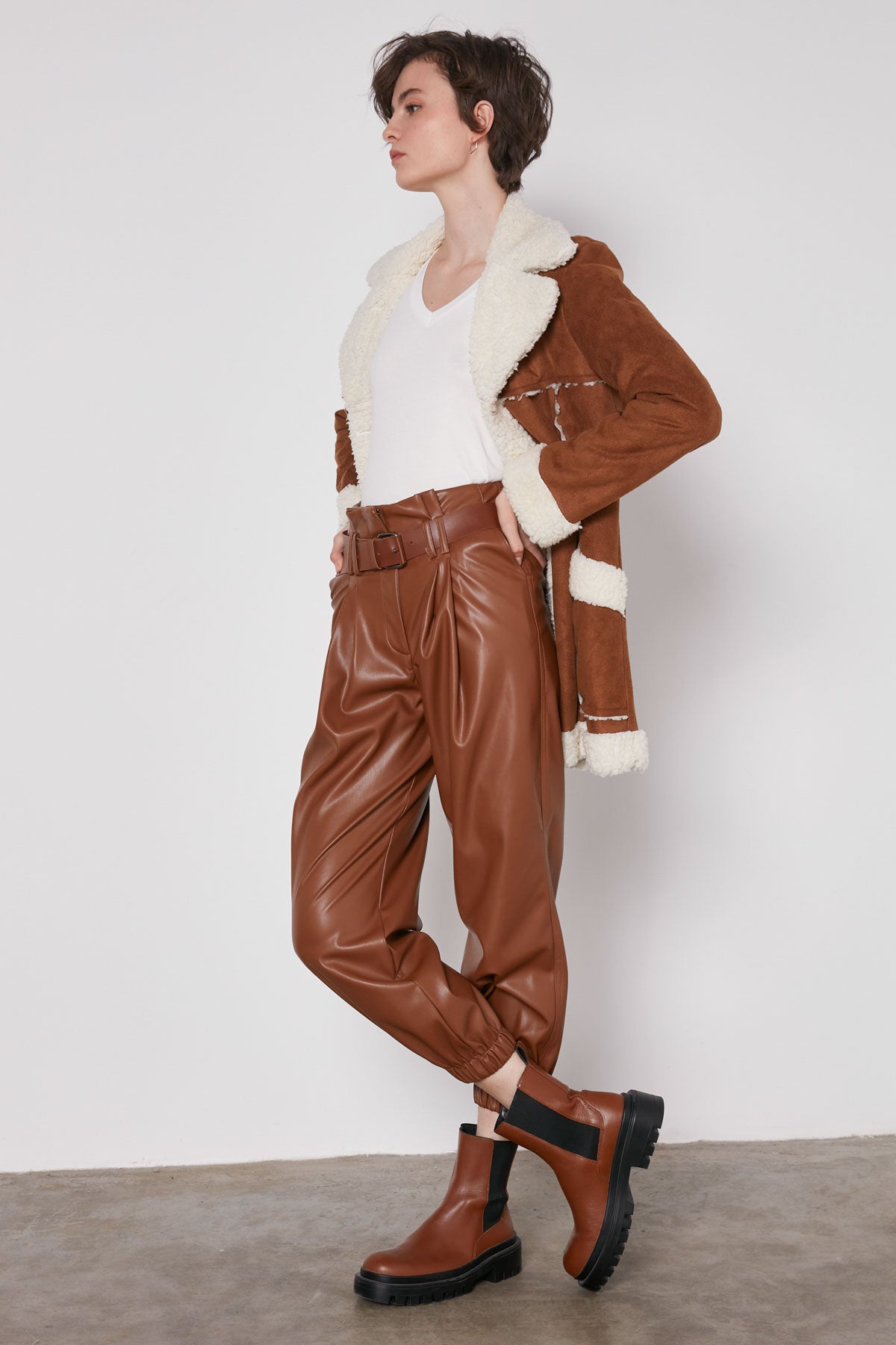 ARCHED BELT TRACK ELASTANE WAIST FAUX LEATHER TROUSERS