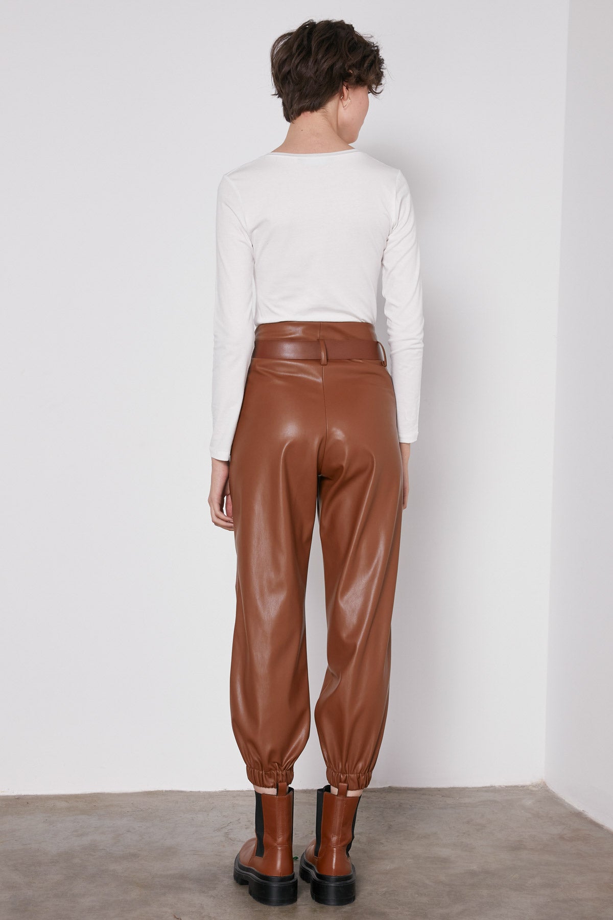 ARCHED BELT TRACK ELASTANE WAIST FAUX LEATHER TROUSERS