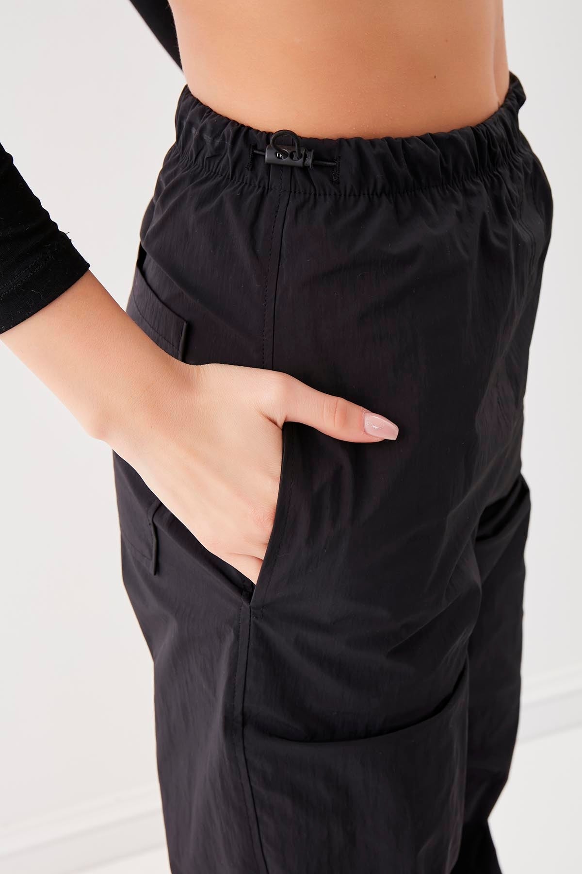 RUBBER-DETAILED PARACHUTE FABRIC TROUSERS
