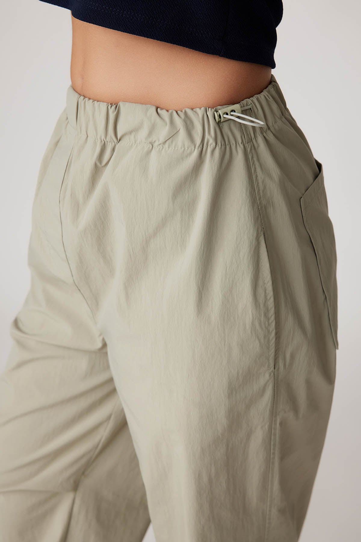 RUBBER-DETAILED PARACHUTE FABRIC TROUSERS