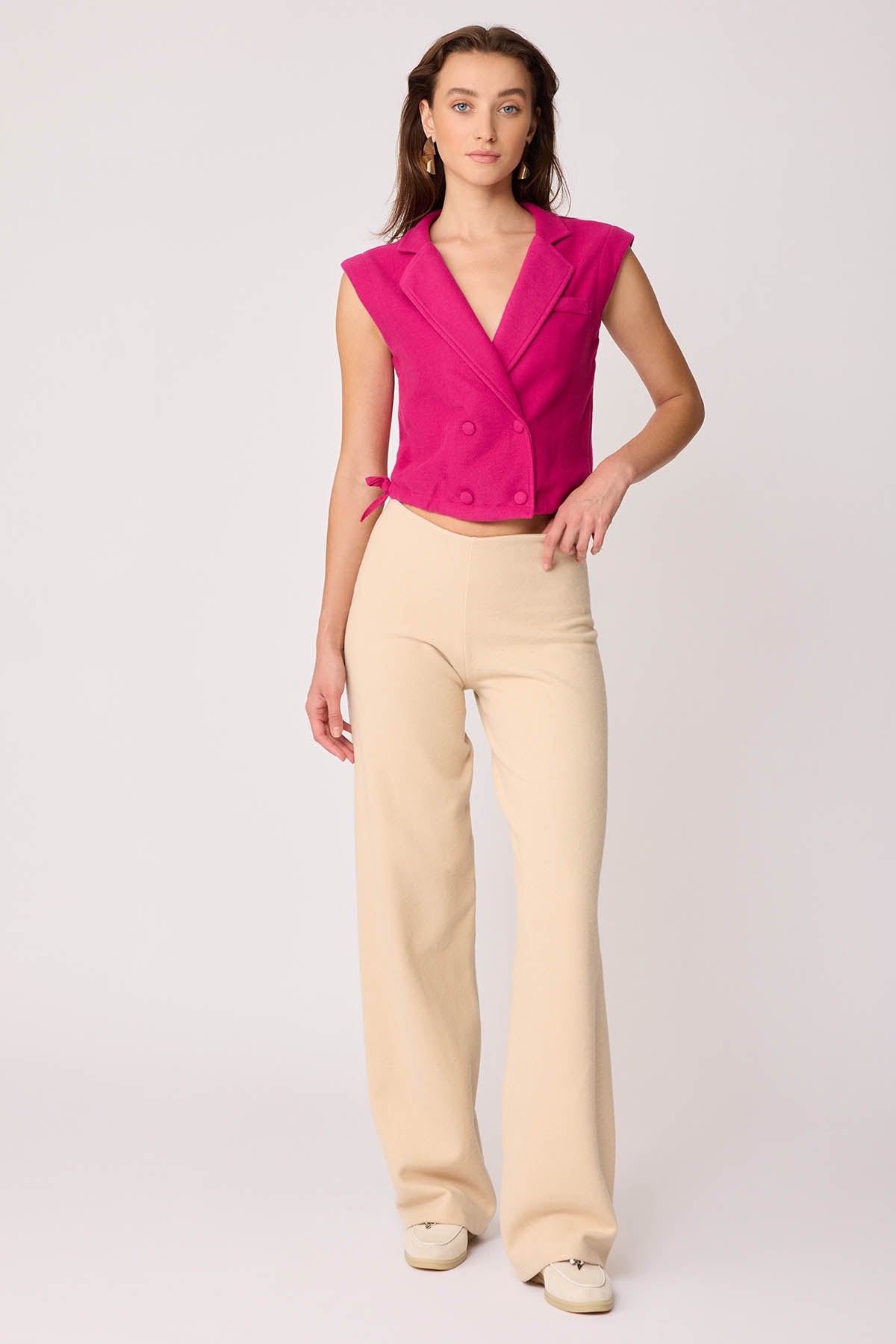 KNITTED VEST WITH WEDGE BUTTONS