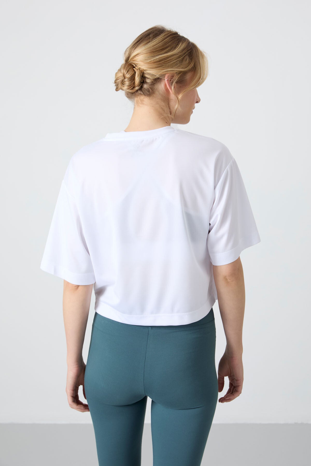 White Polyester Breathable Textured Thin Flexible Oversize Fit Performance Women's T-Shirt - 97284