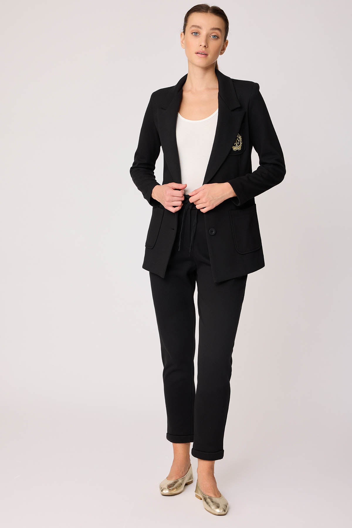 TRACKSUIT TROUSERS WITH LACED POCKETS
