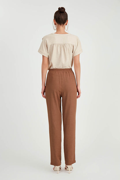 COMFORTABLE TROUSERS WITH LACED POCKETS