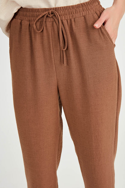 COMFORTABLE TROUSERS WITH LACED POCKETS