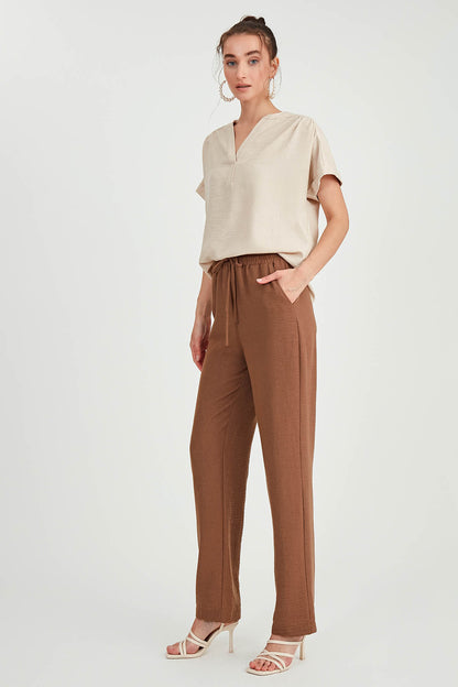 COMFORTABLE TROUSERS WITH LACED POCKETS