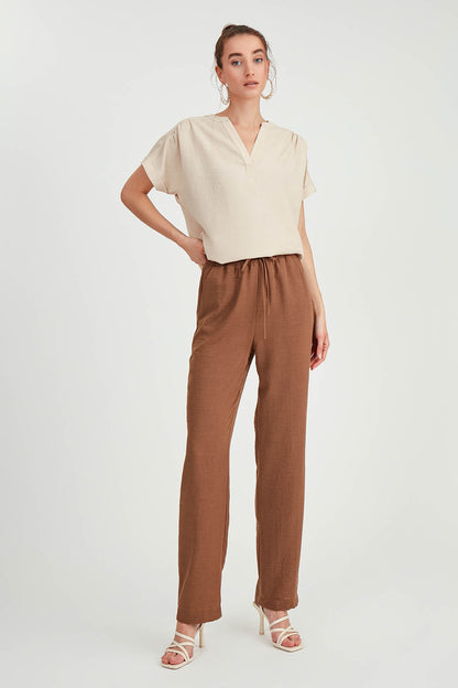 COMFORTABLE TROUSERS WITH LACED POCKETS