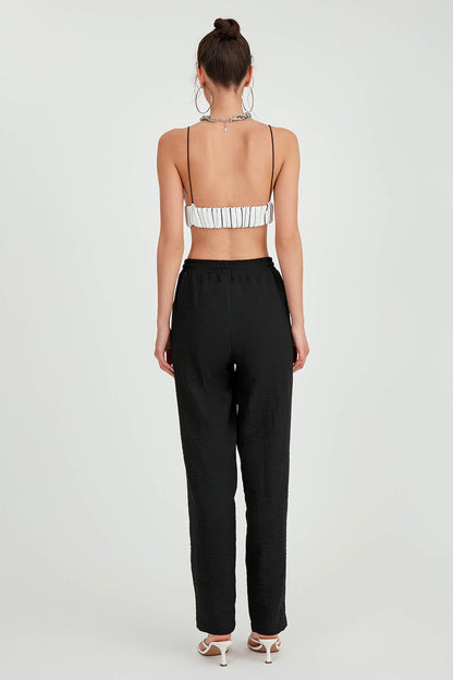 COMFORTABLE TROUSERS WITH LACED POCKETS