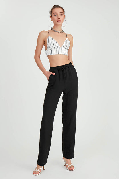 COMFORTABLE TROUSERS WITH LACED POCKETS