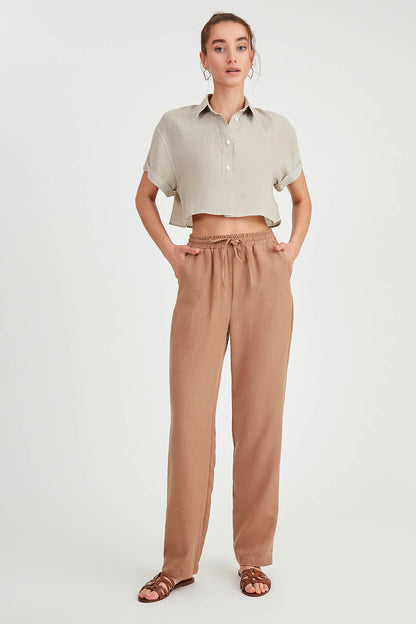 COMFORTABLE TROUSERS WITH LACED POCKETS