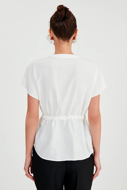 LOOSE BLOUSE WITH RUCKLEBAR BUTTONS