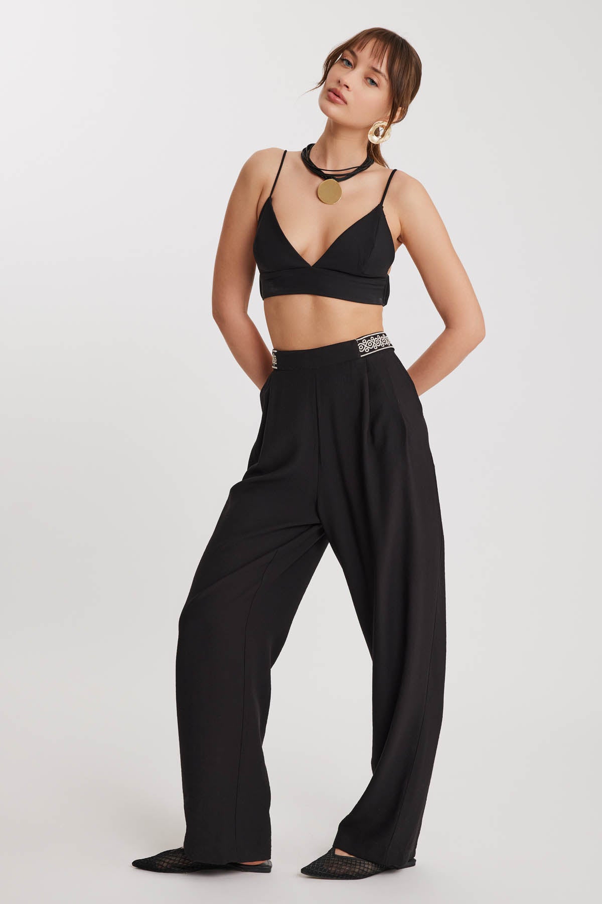 PLEATED TROUSERS WITH ETHNIC PATTERNED WAIST