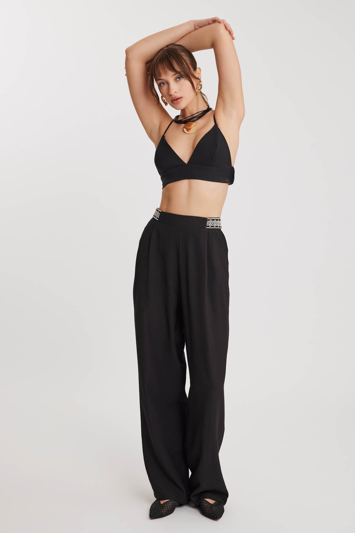 PLEATED TROUSERS WITH ETHNIC PATTERNED WAIST