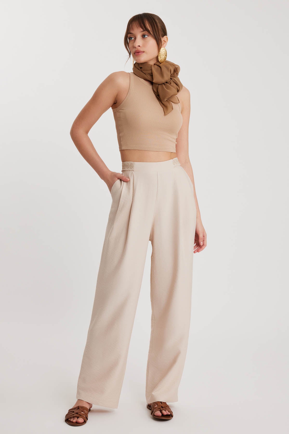 PLEATED TROUSERS WITH ETHNIC PATTERNED WAIST