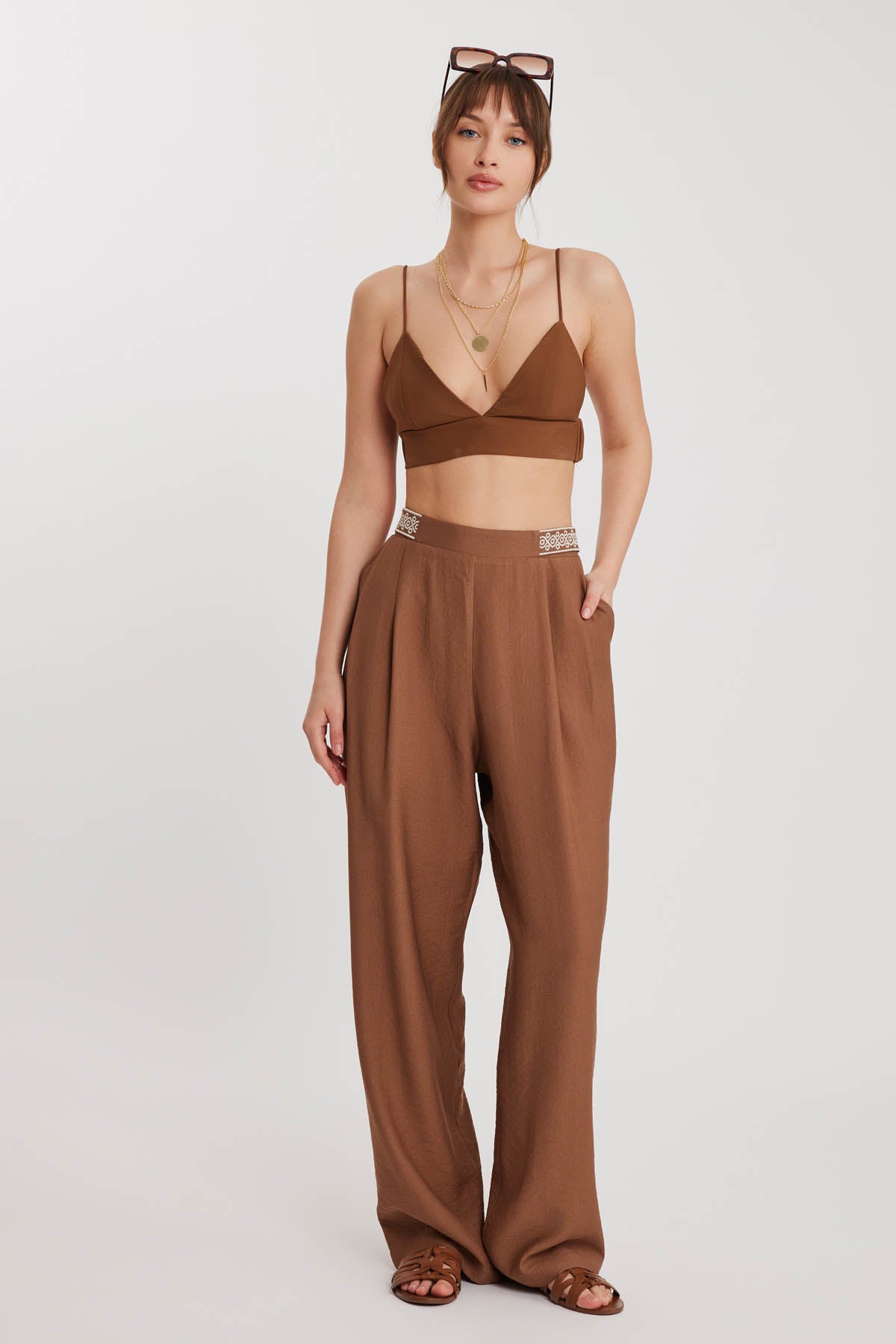 PLEATED TROUSERS WITH ETHNIC PATTERNED WAIST