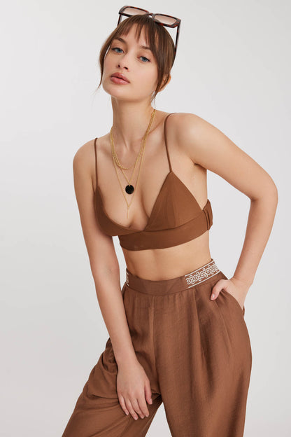 PLEATED TROUSERS WITH ETHNIC PATTERNED WAIST