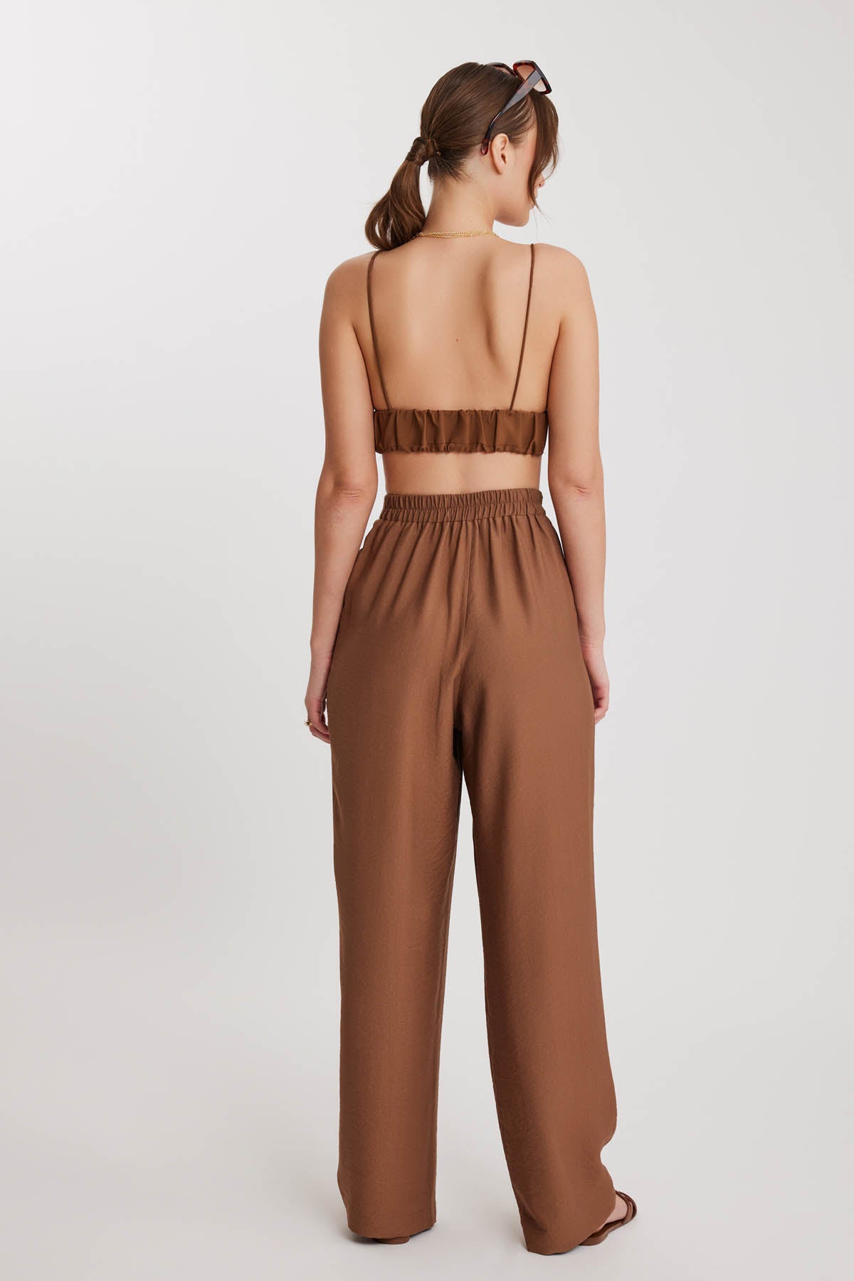 PLEATED TROUSERS WITH ETHNIC PATTERNED WAIST