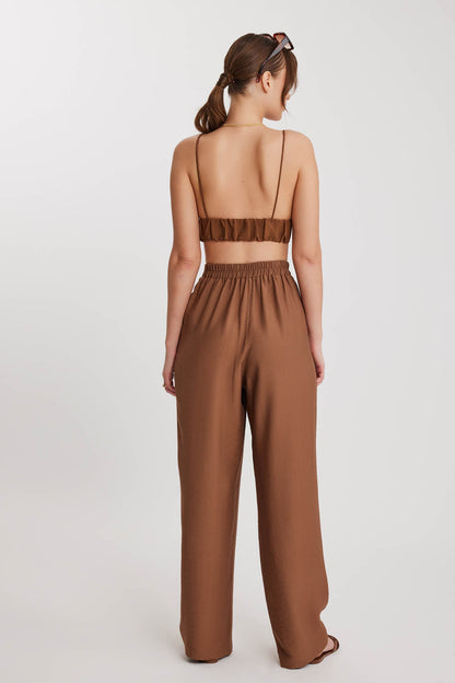 PLEATED TROUSERS WITH ETHNIC PATTERNED WAIST
