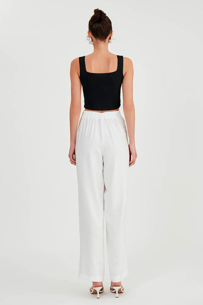 PLEATED TROUSERS WITH ETHNIC PATTERNED WAIST