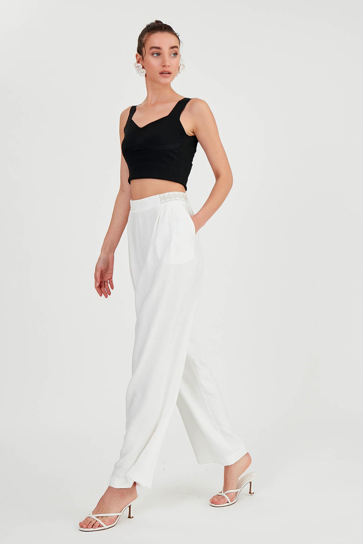 PLEATED TROUSERS WITH ETHNIC PATTERNED WAIST
