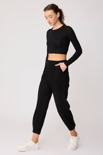KNITTED TROUSERS WITH CUTOUT BUTTONS