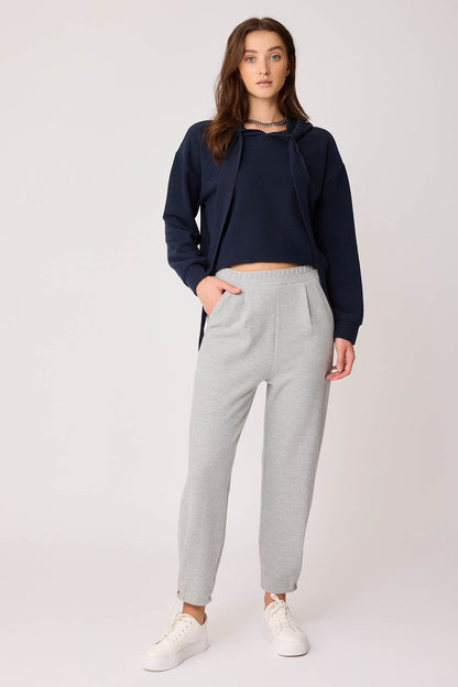 KNITTED TROUSERS WITH CUTOUT BUTTONS