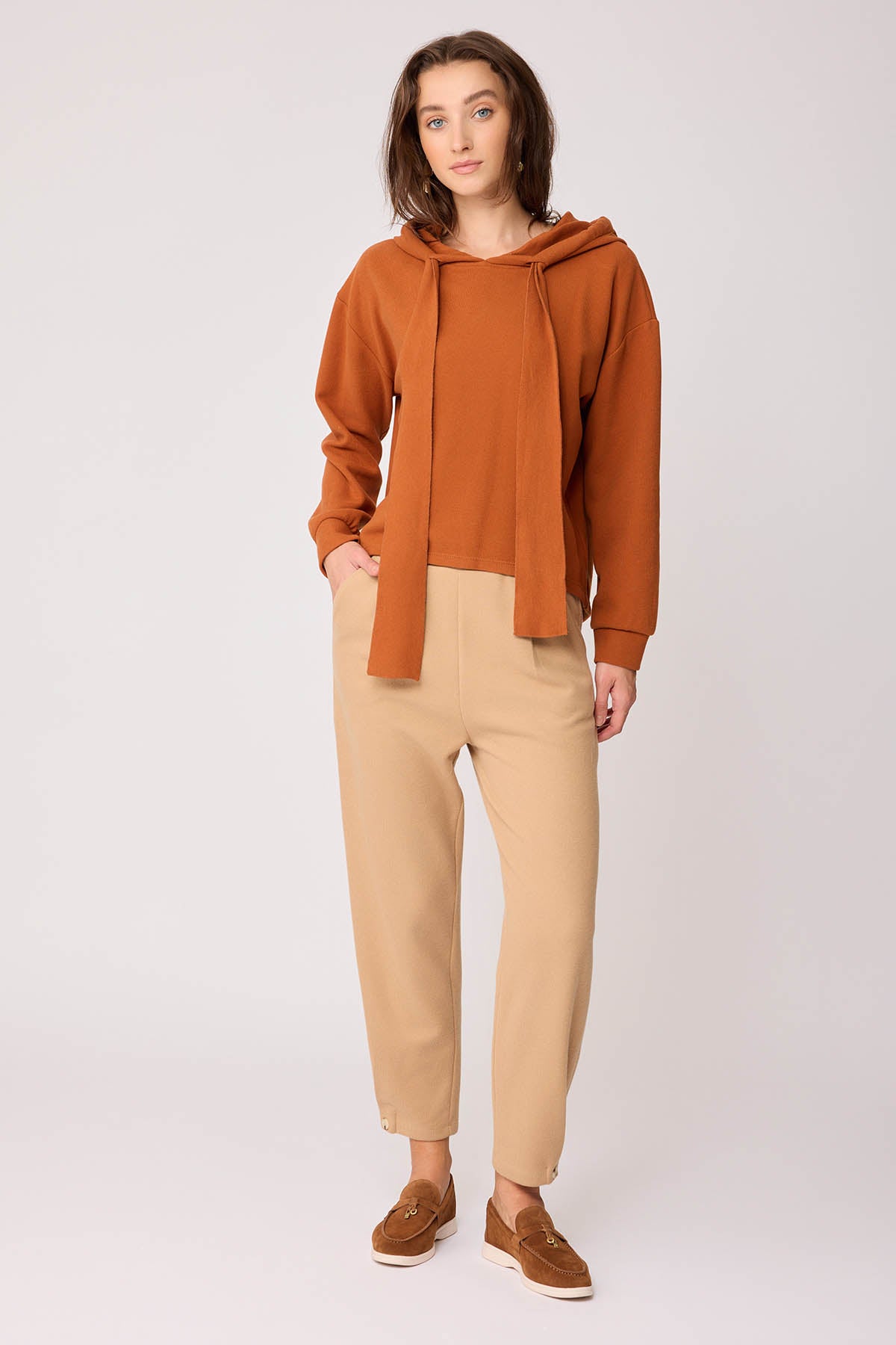 KNITTED TROUSERS WITH CUTOUT BUTTONS