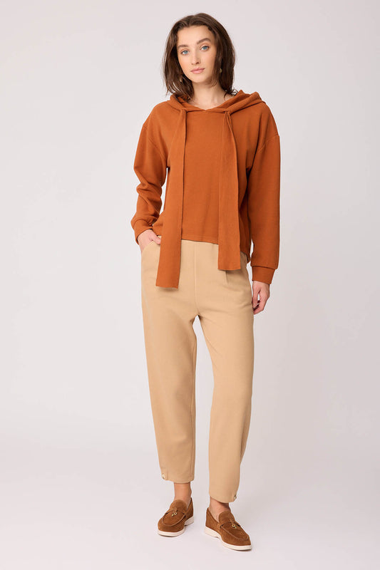 KNITTED TROUSERS WITH CUTOUT BUTTONS