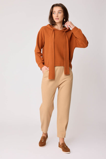 KNITTED TROUSERS WITH CUTOUT BUTTONS