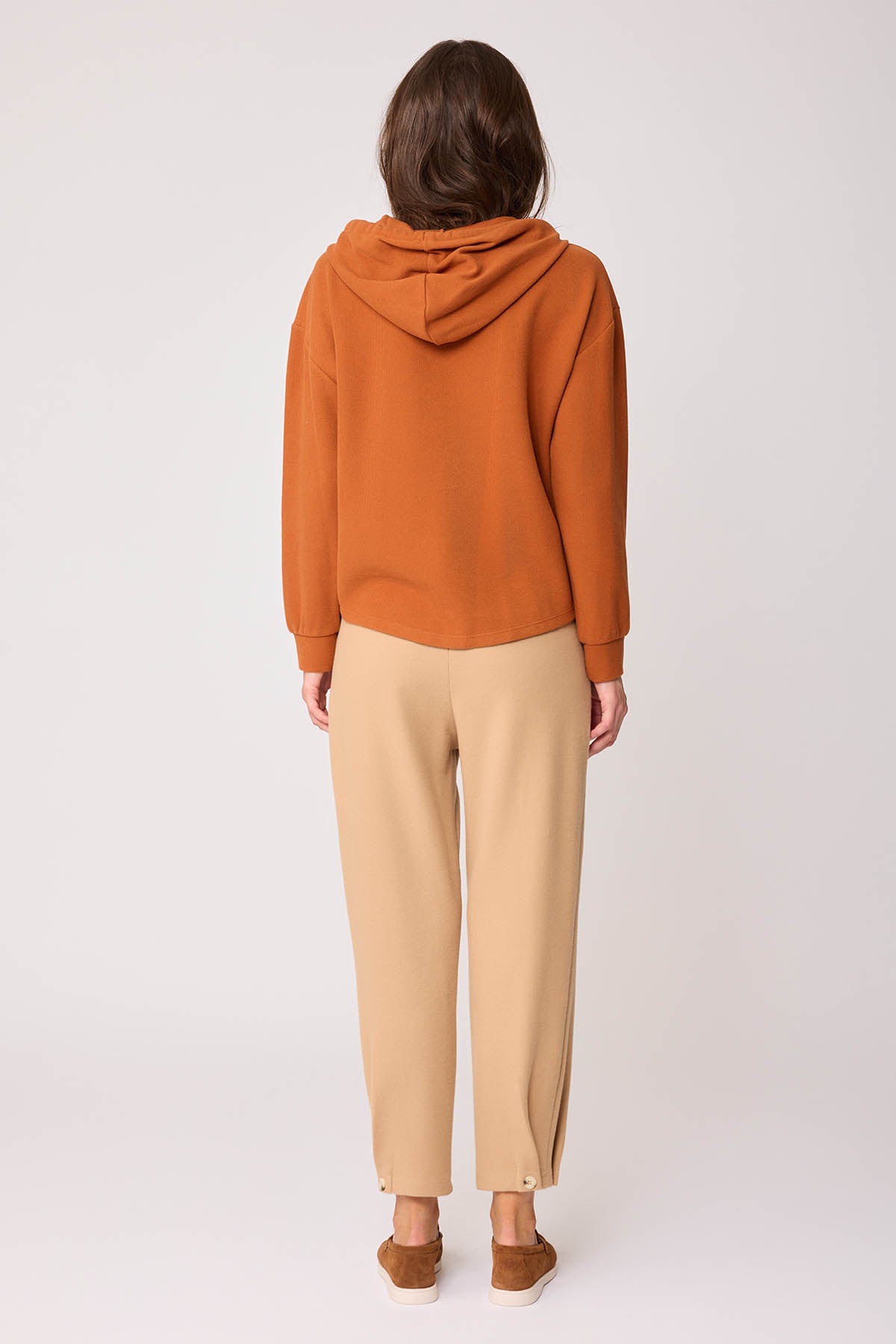 KNITTED TROUSERS WITH CUTOUT BUTTONS