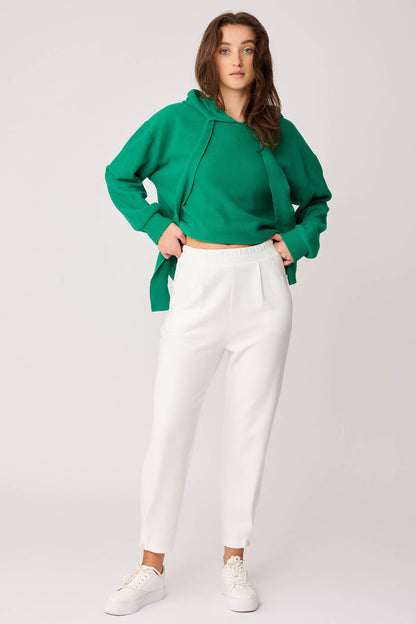KNITTED TROUSERS WITH CUTOUT BUTTONS