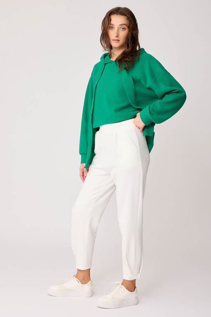 KNITTED TROUSERS WITH CUTOUT BUTTONS