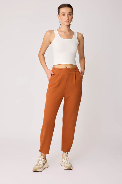 KNITTED TROUSERS WITH CUTOUT BUTTONS