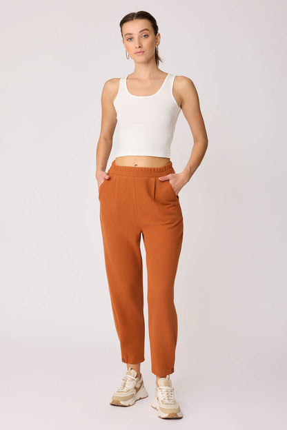 KNITTED TROUSERS WITH CUTOUT BUTTONS
