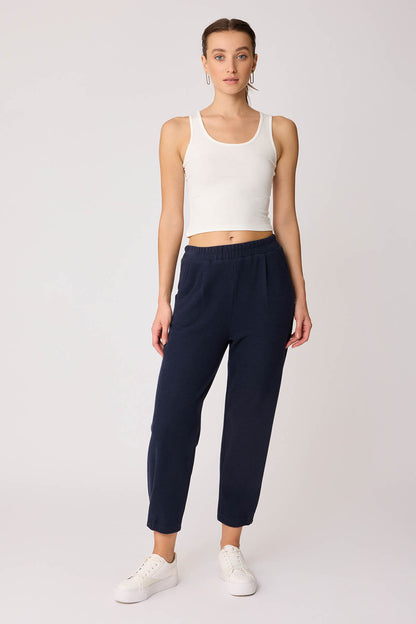 KNITTED TROUSERS WITH CUTOUT BUTTONS