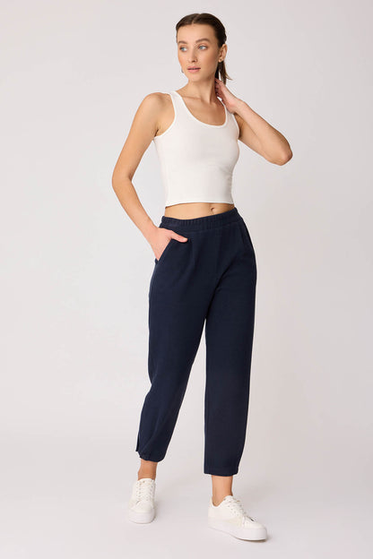 KNITTED TROUSERS WITH CUTOUT BUTTONS