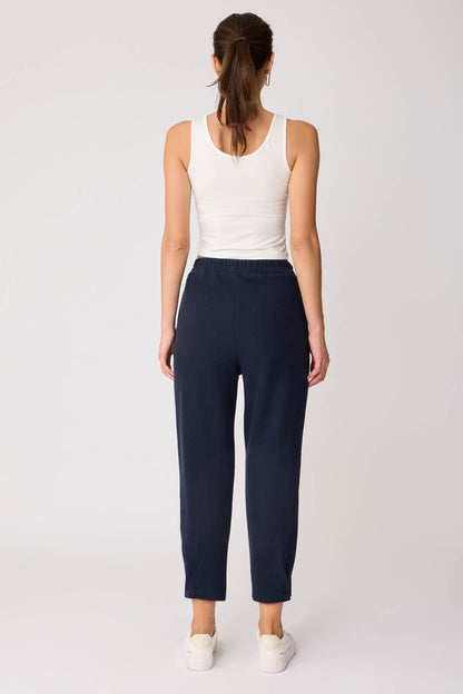 KNITTED TROUSERS WITH CUTOUT BUTTONS