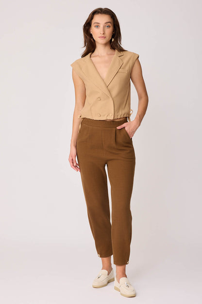 KNITTED TROUSERS WITH CUTOUT BUTTONS