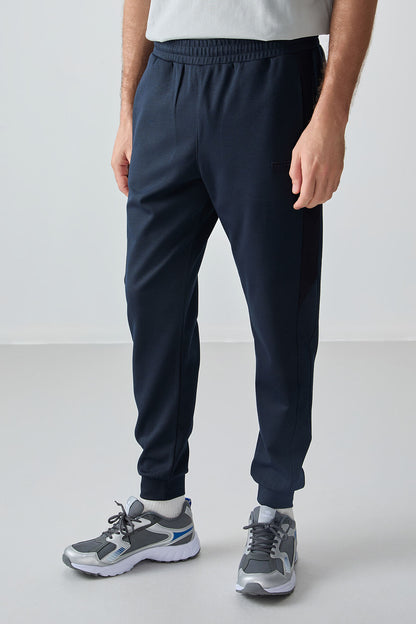 Navy Blue Textured Surface Standard Fit Embroidered Men's Tracksuit Bottom - 82126