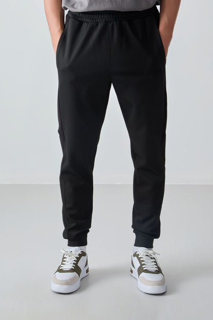 Black Textured Surface Standard Fit Embroidered Men's Tracksuit Bottom - 82126