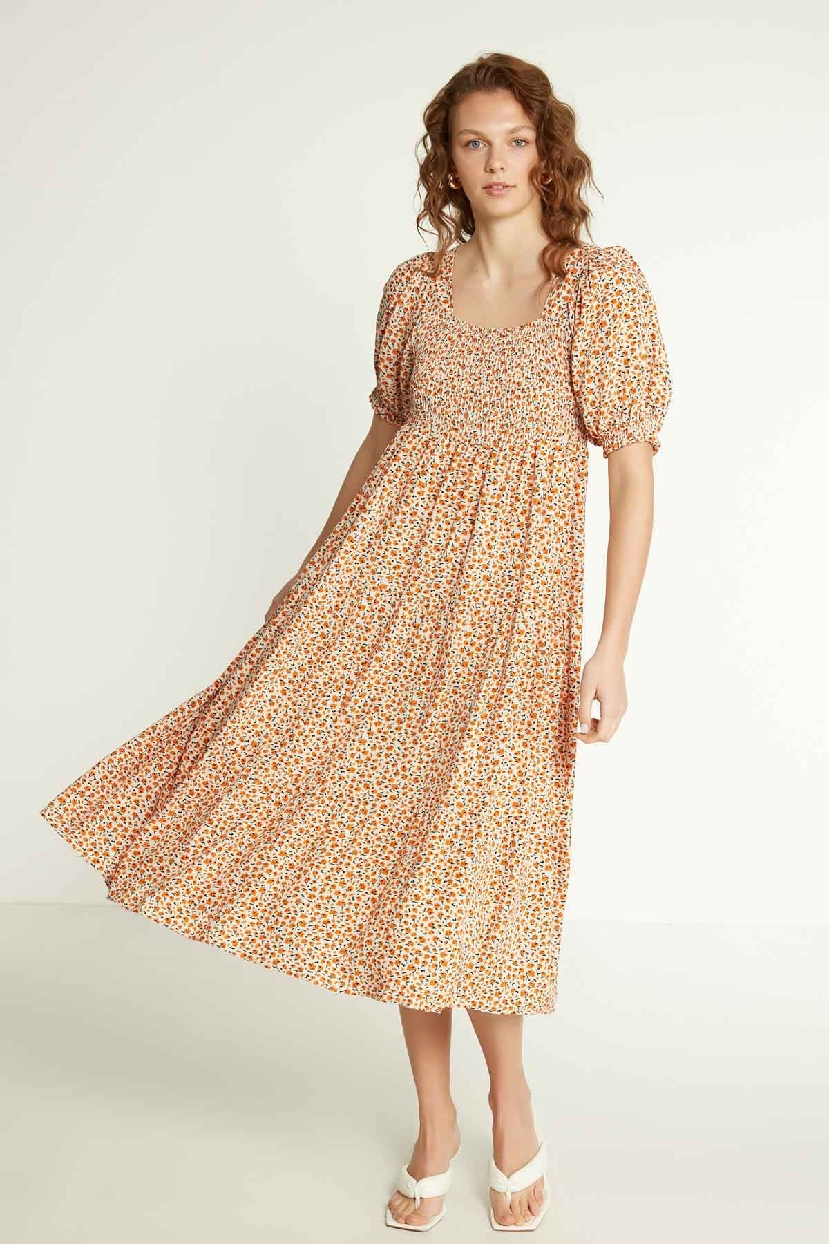 LONG DRESS WITH COILED SLEEVES AND FLORAL PATTERN