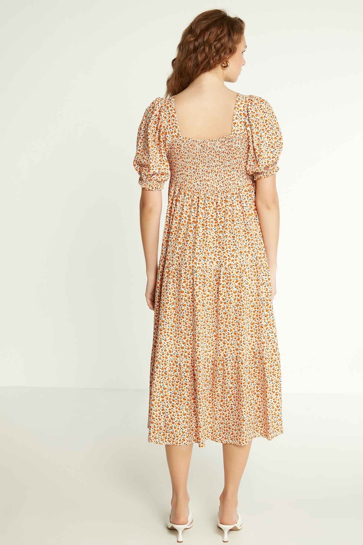LONG DRESS WITH COILED SLEEVES AND FLORAL PATTERN