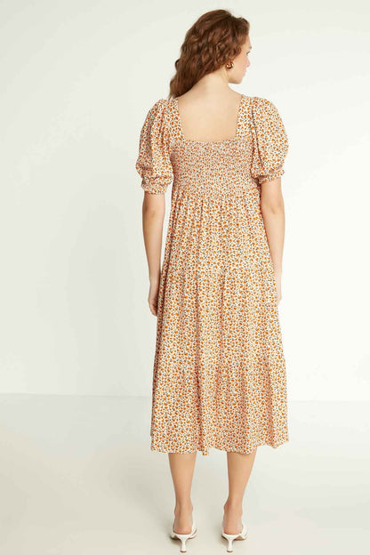 LONG DRESS WITH COILED SLEEVES AND FLORAL PATTERN